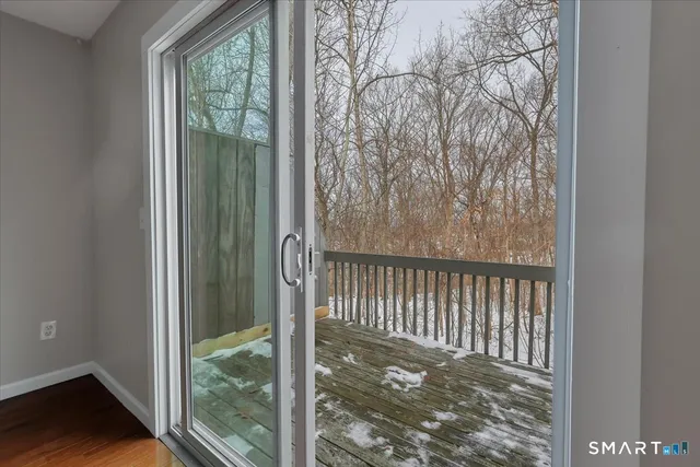 a view of a porch with a floor to ceiling window