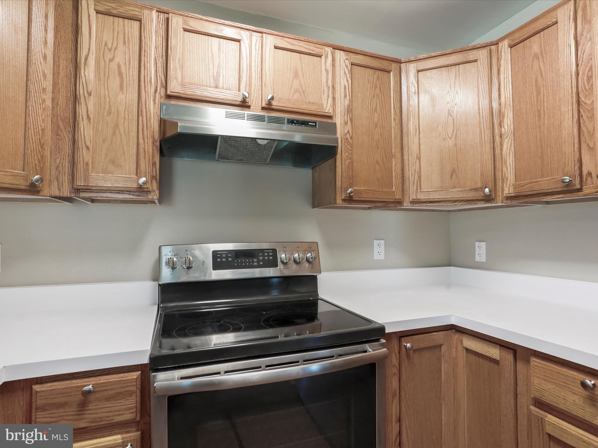 11312 King George Drive, Unit 4 Wheaton, MD 20902 - Photo 12 of 28 a kitchen with granite countertop a stove and a sink