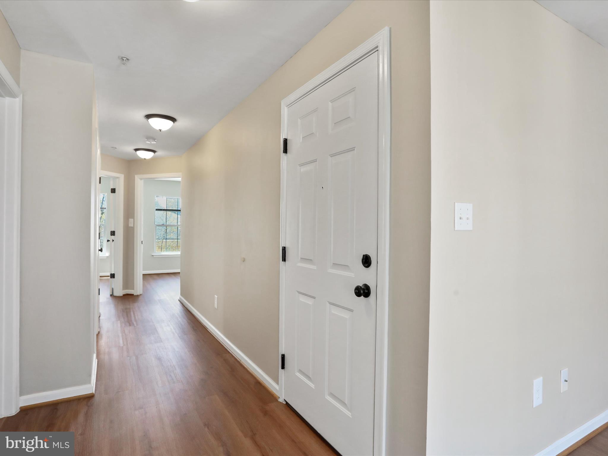 11312 King George Drive, Unit 4 Wheaton, MD 20902 - Photo 15 of 28 a view of a hallway with wooden floor