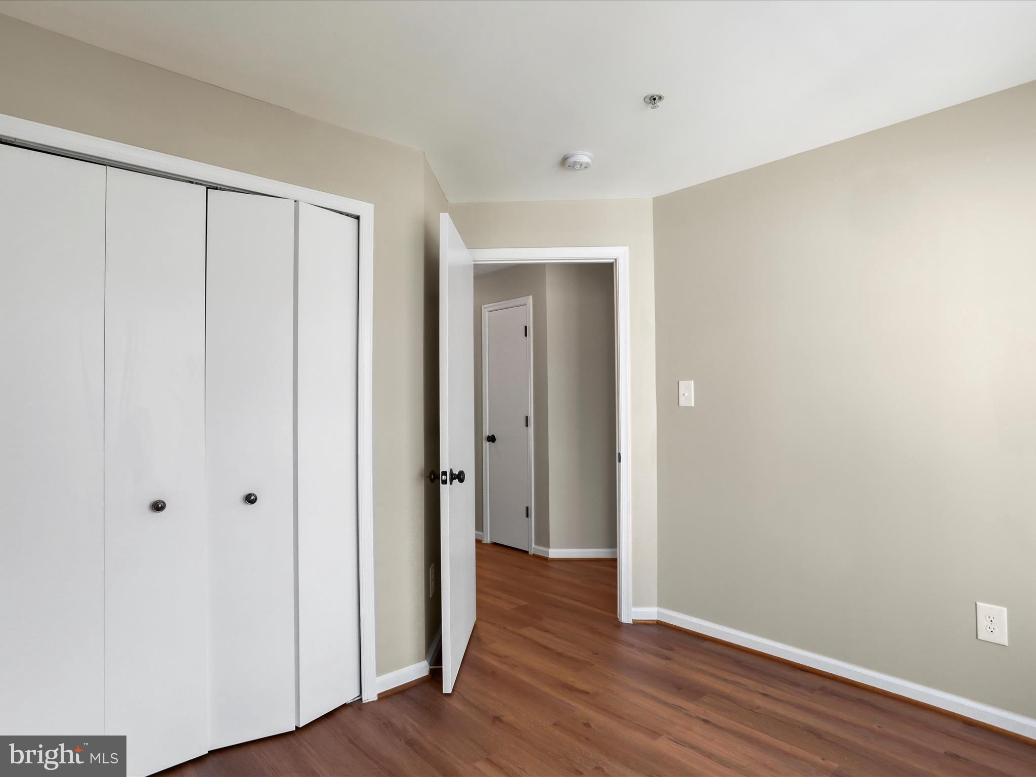 11312 King George Drive, Unit 4 Wheaton, MD 20902 - Photo 19 of 28 a view of an empty room with wooden floor