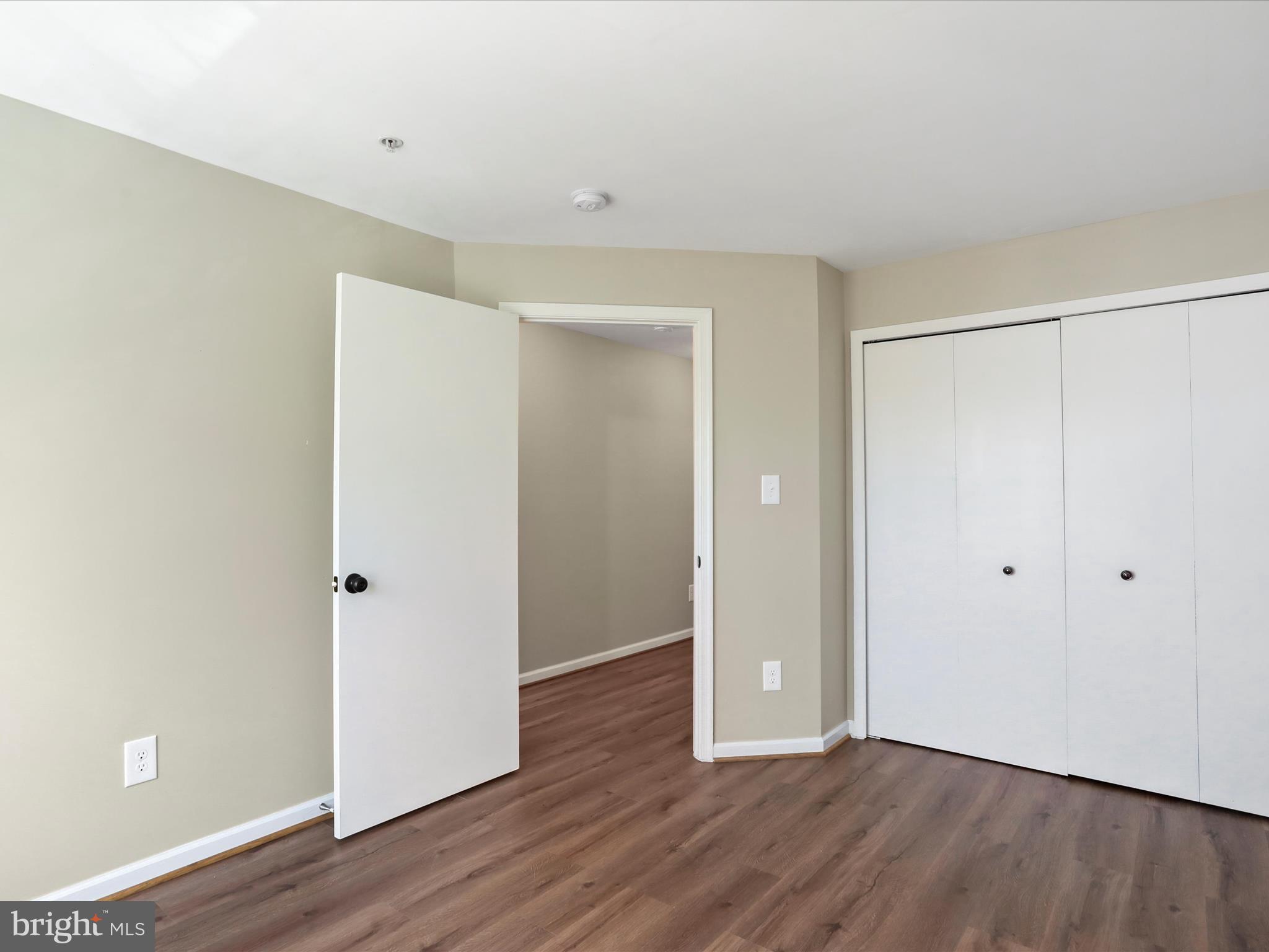 11312 King George Drive, Unit 4 Wheaton, MD 20902 - Photo 22 of 28 a view of an empty room with wooden floor