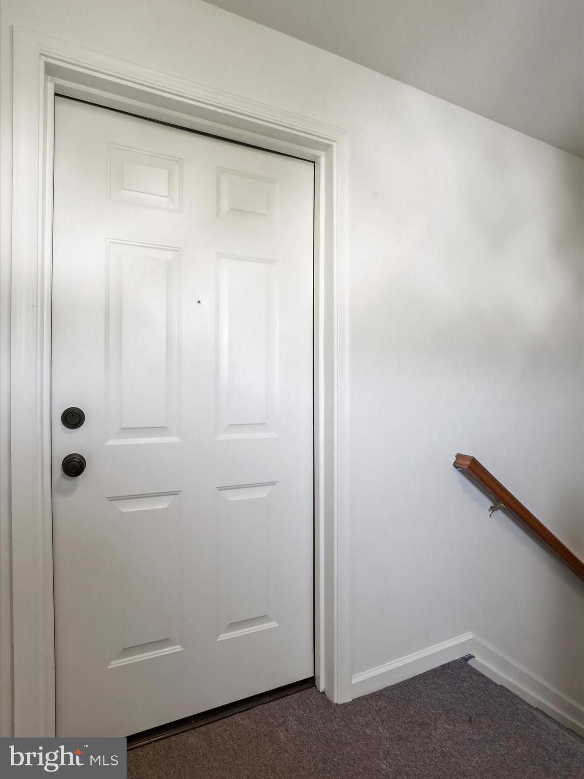 11312 King George Drive, Unit 4 Wheaton, MD 20902 - Photo 25 of 28 a bathroom with a glass shower door