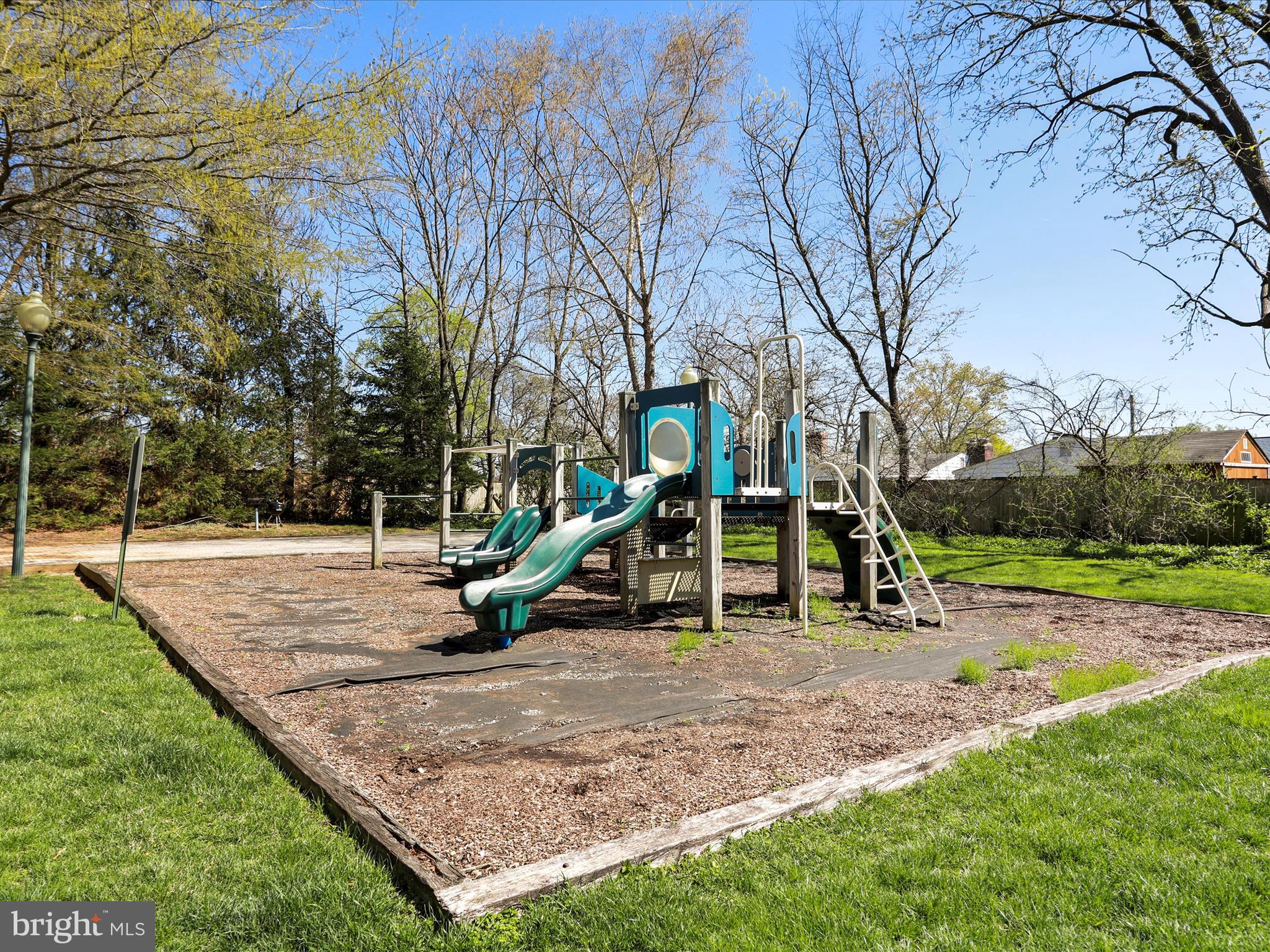 11312 King George Drive, Unit 4 Wheaton, MD 20902 - Photo 27 of 28 a view of outdoor space with playground and green space