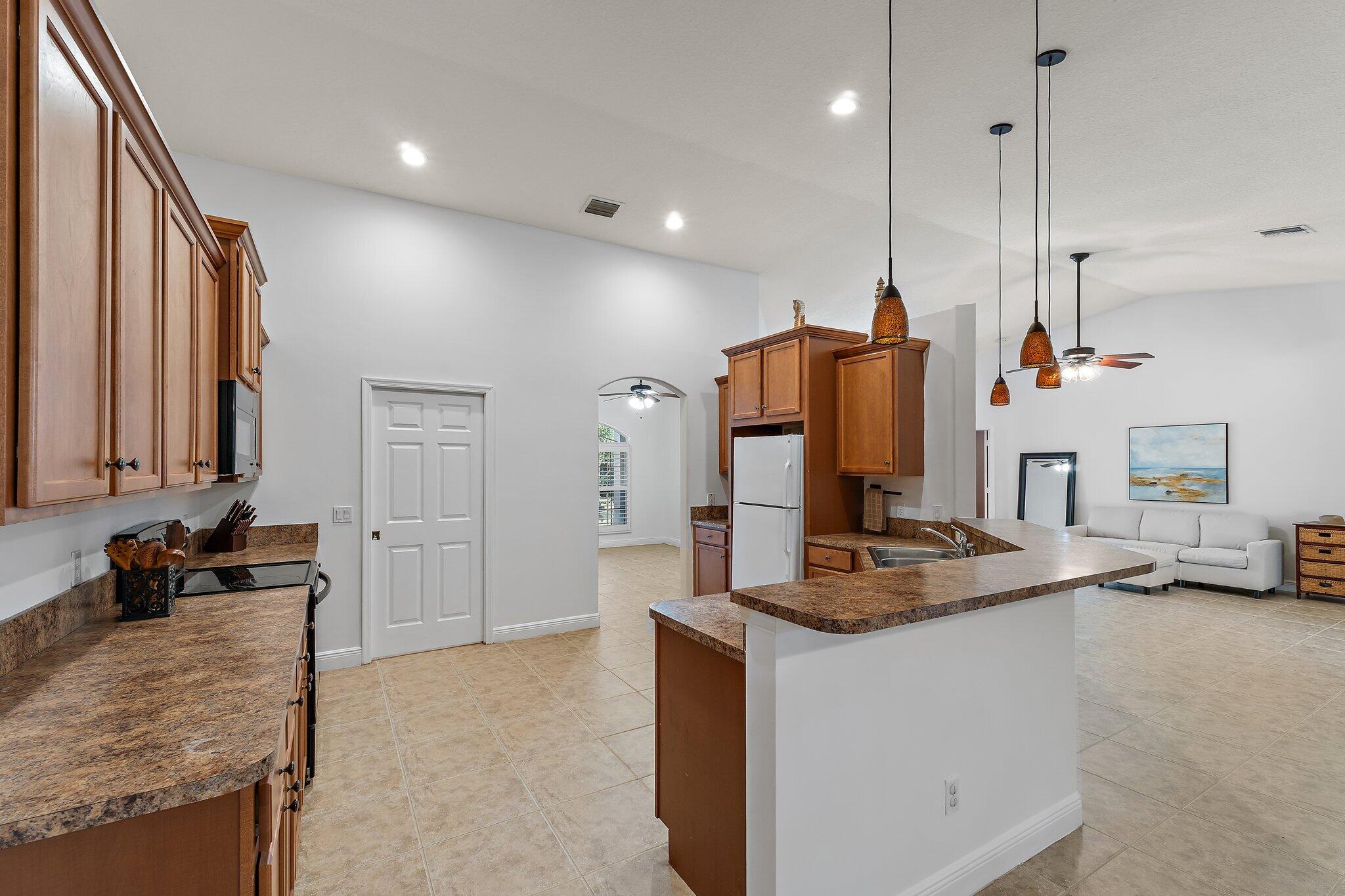 9608 Mockingbird Trail Jupiter, FL 33478 - Photo 21 of 49 Kitch to great room