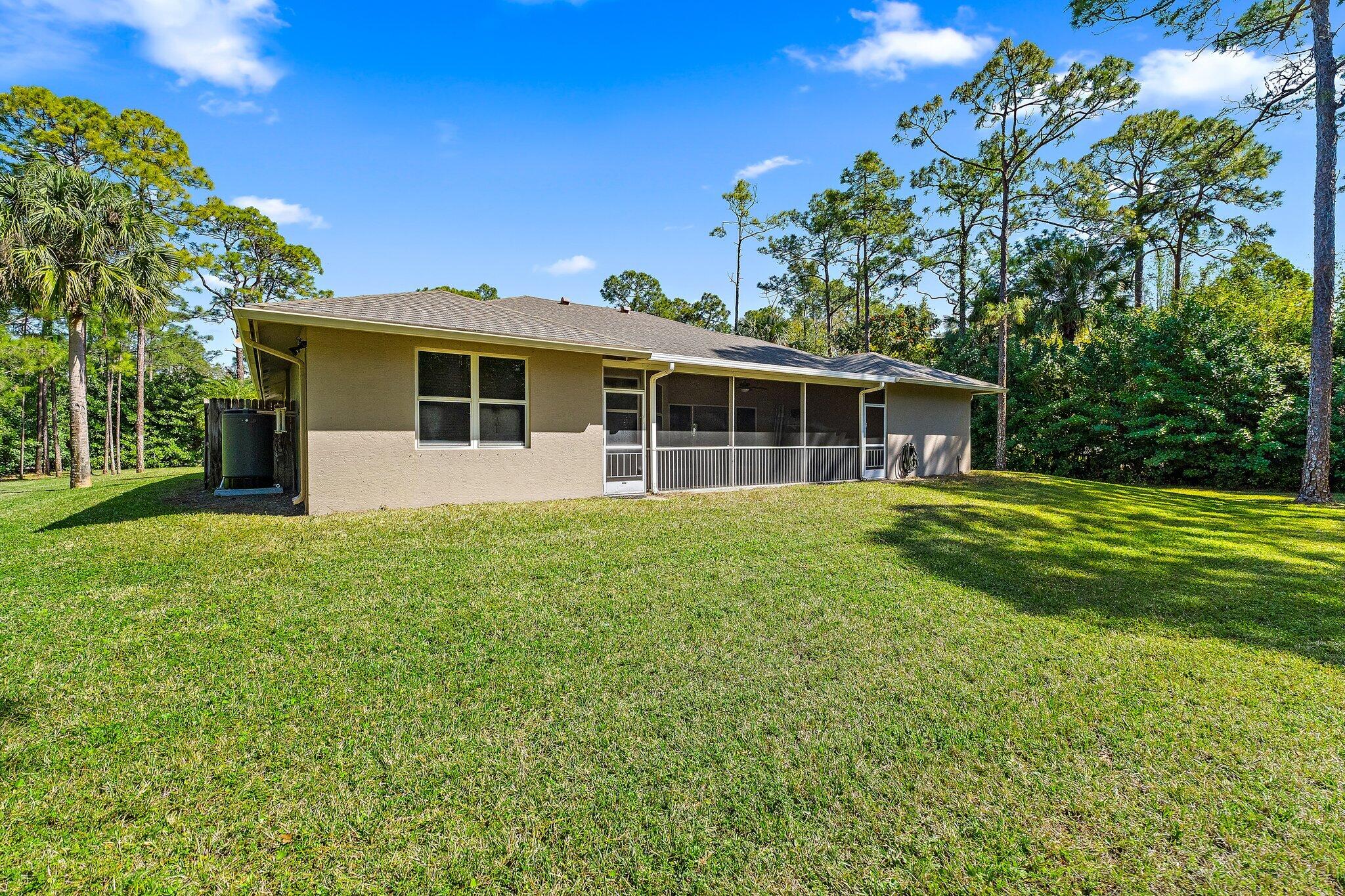 9608 Mockingbird Trail Jupiter, FL 33478 - Photo 38 of 49 Back exterior