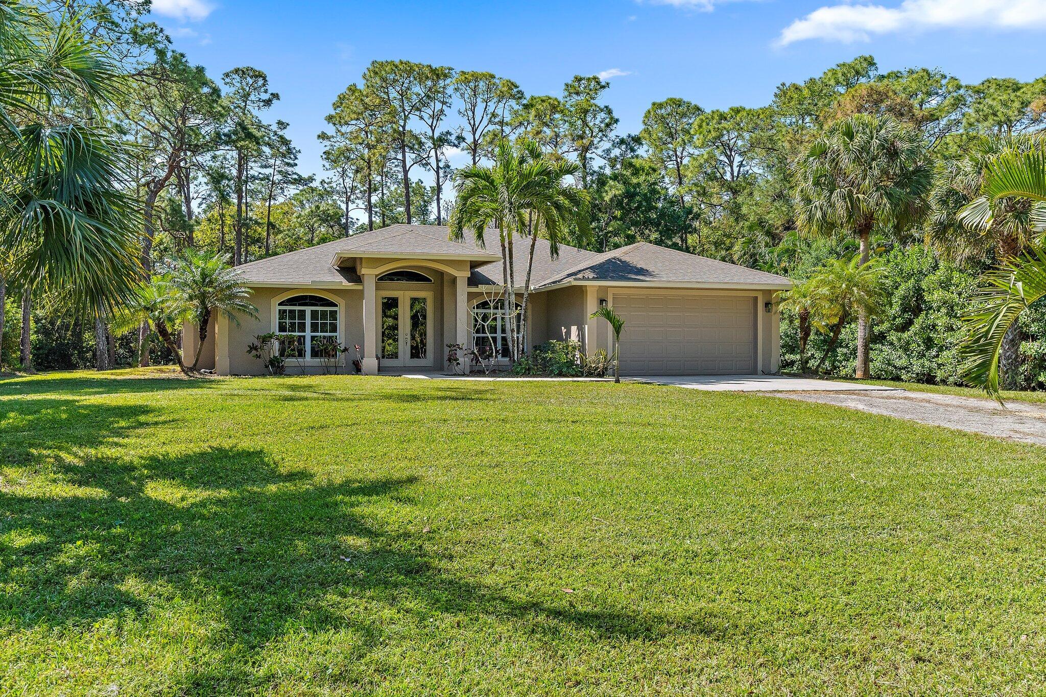 9608 Mockingbird Trail Jupiter, FL 33478 - Photo 7 of 49 Front