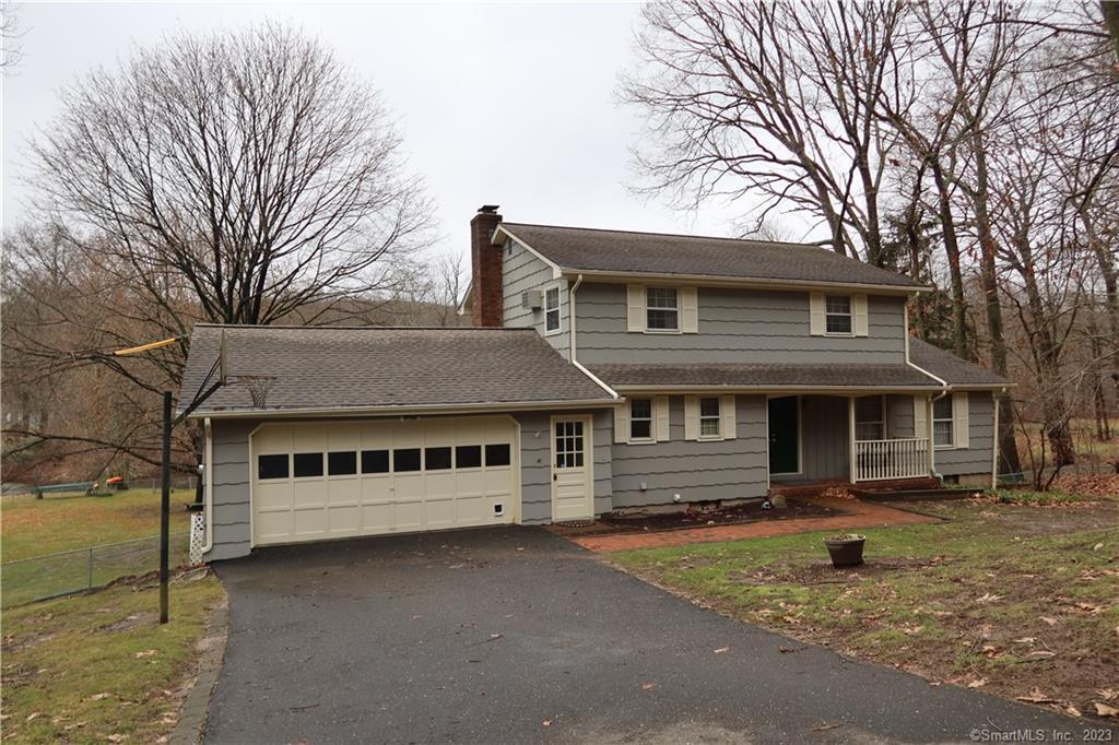 33 Treeland Road Shelton, CT 06484 - Photo 1 of 1 a front view of a house with a garden