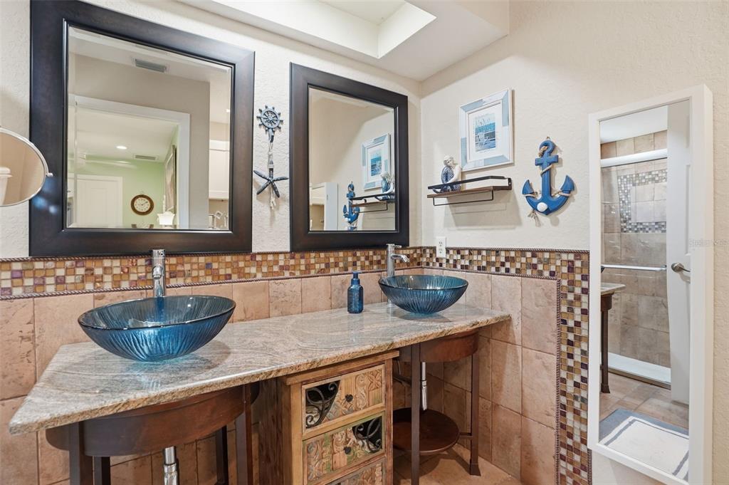 2658 Royal Ridge Drive Spring Hill, FL 34606 - Photo 13 of 38 a bathroom with a sink and a mirror