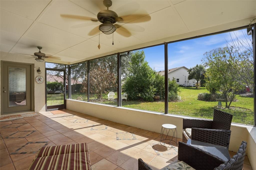 2658 Royal Ridge Drive Spring Hill, FL 34606 - Photo 18 of 38 a view of a porch with furniture and garden