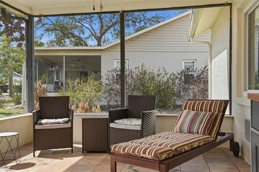 2658 Royal Ridge Drive Spring Hill, FL 34606 - Photo 19 of 38 a outdoor living space with furniture and a potted plant