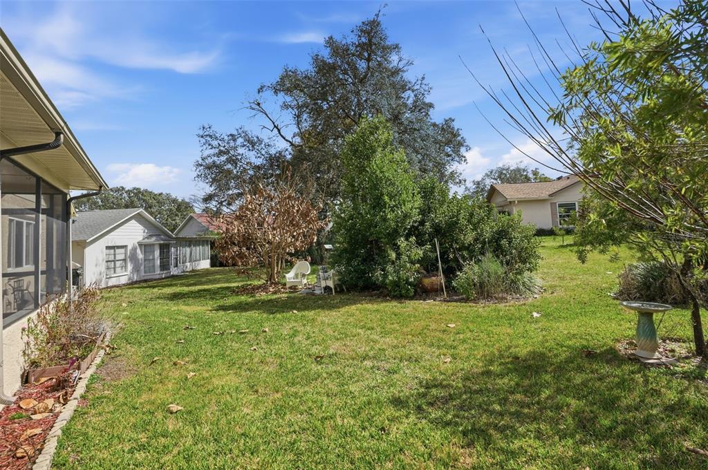 2658 Royal Ridge Drive Spring Hill, FL 34606 - Photo 20 of 38 a front view of a house with a yard