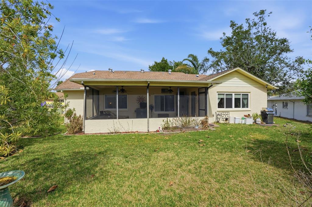 2658 Royal Ridge Drive Spring Hill, FL 34606 - Photo 24 of 38 front view of a house with a yard