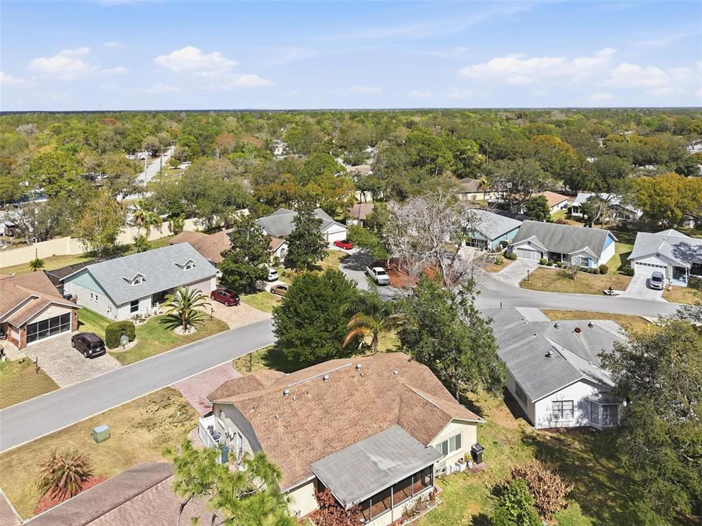 2658 Royal Ridge Drive Spring Hill, FL 34606 - Photo 28 of 38 an aerial view of residential houses with outdoor space and swimming pool