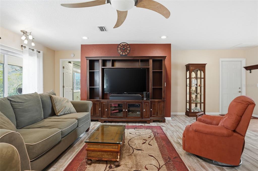 2658 Royal Ridge Drive Spring Hill, FL 34606 - Photo 35 of 38 a living room with furniture and a flat screen tv