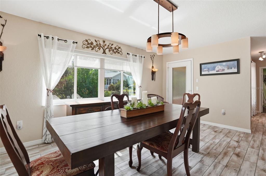 2658 Royal Ridge Drive Spring Hill, FL 34606 - Photo 8 of 38 a dining room with furniture and window