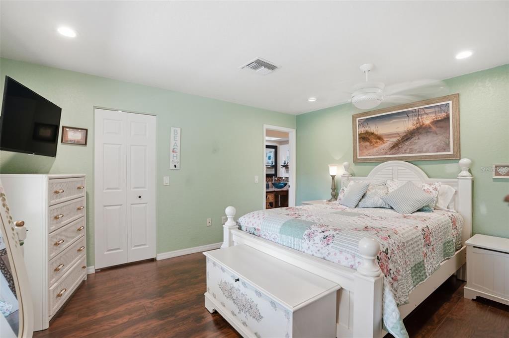2658 Royal Ridge Drive Spring Hill, FL 34606 - Photo 9 of 38 a bedroom with a bed and a flat screen tv
