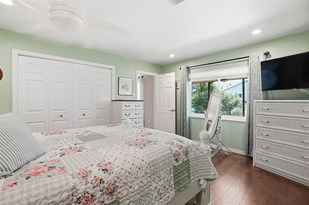 2658 Royal Ridge Drive Spring Hill, FL 34606 - Photo 10 of 38 a bedroom with a bed and a flat screen tv