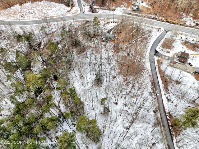 a view of water covered with snow in the background