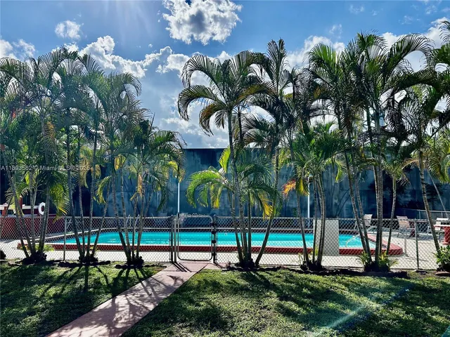 a view of a park with swings and slides