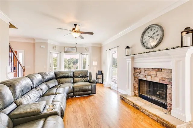 a view of a livingroom with furniture wooden floor and front door