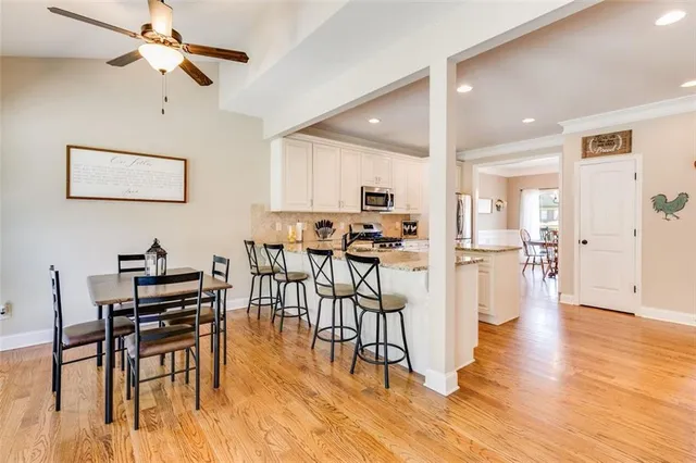 a kitchen with sink stove and cabinets