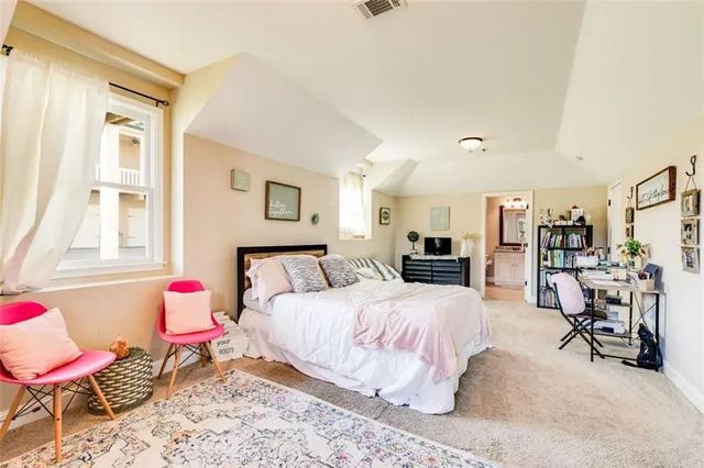 a bedroom with a bed and furniture