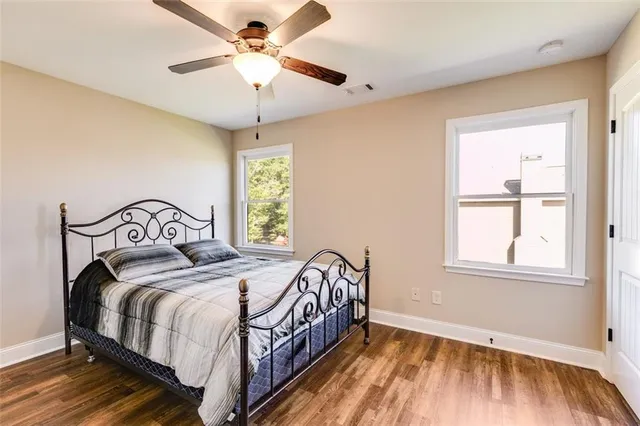 a bedroom with furniture and a book shelf
