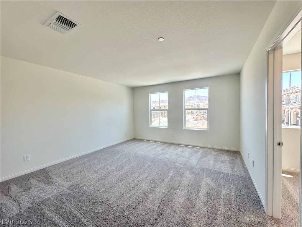 2121 Tricase Street Henderson, NV 89044 - Photo 15 of 31 Unfurnished room featuring carpet floors and baseboards