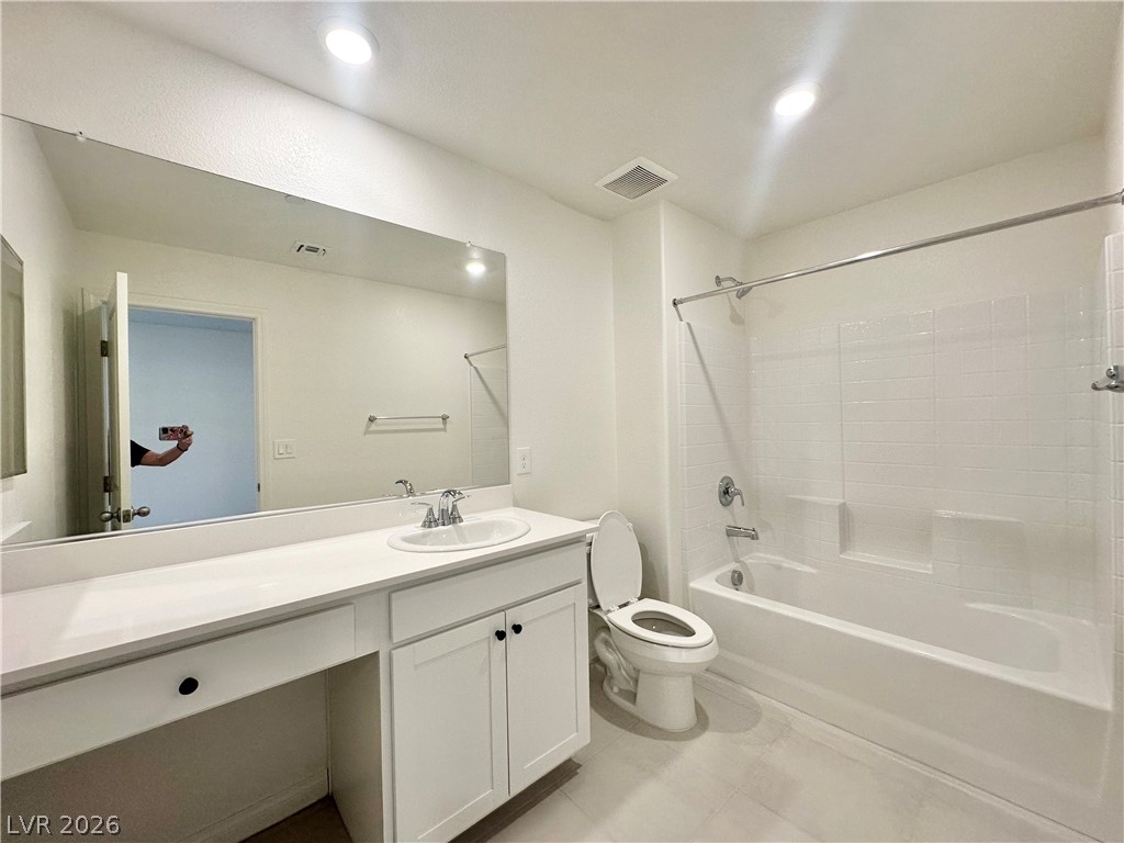 2121 Tricase Street Henderson, NV 89044 - Photo 22 of 31 Bathroom featuring vanity, shower / tub combination, and toilet