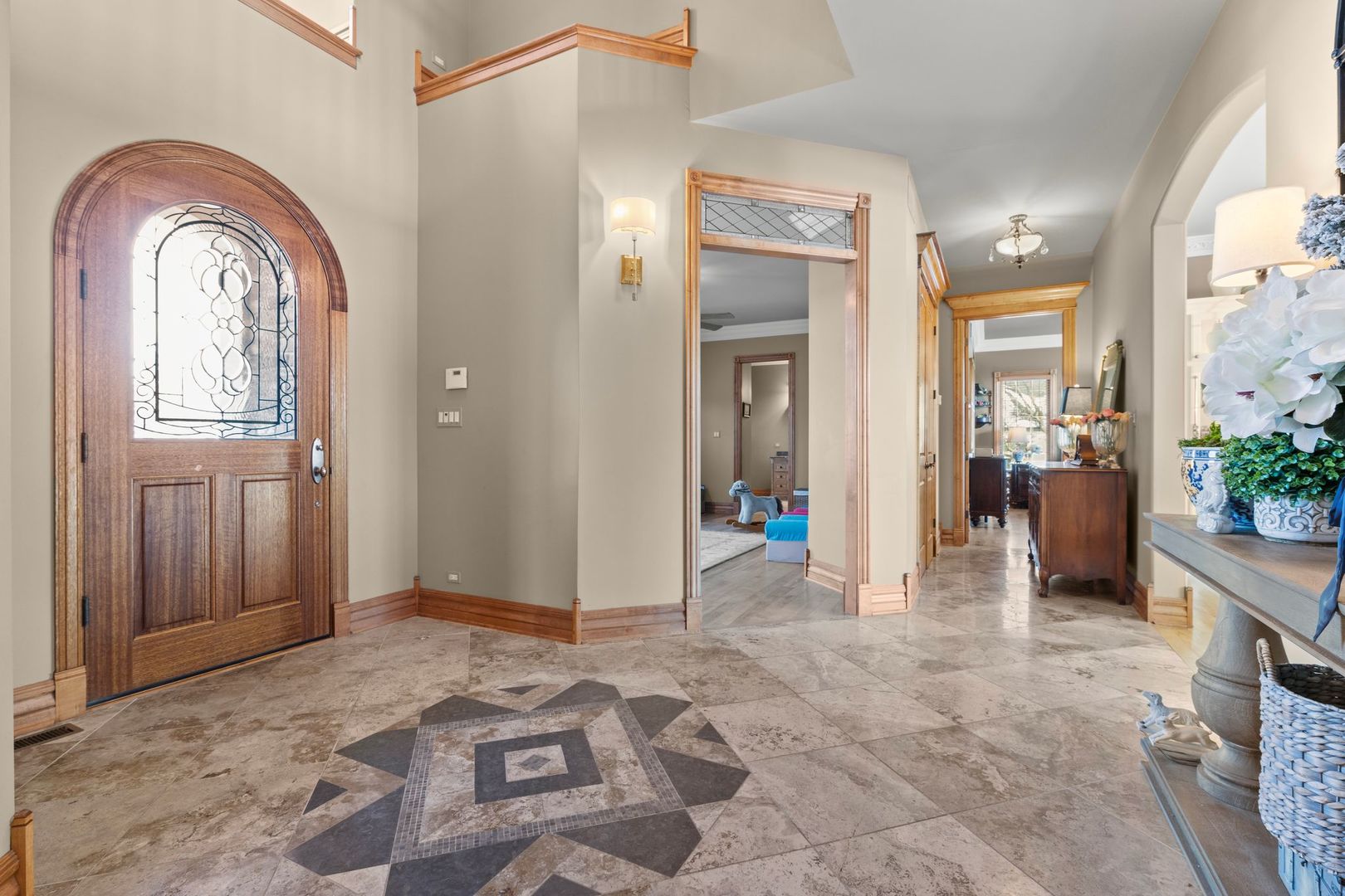 109 Singletree Road Orland Park, IL 60467 - Photo 13 of 66 a view of a livingroom with entryway and wooden floor