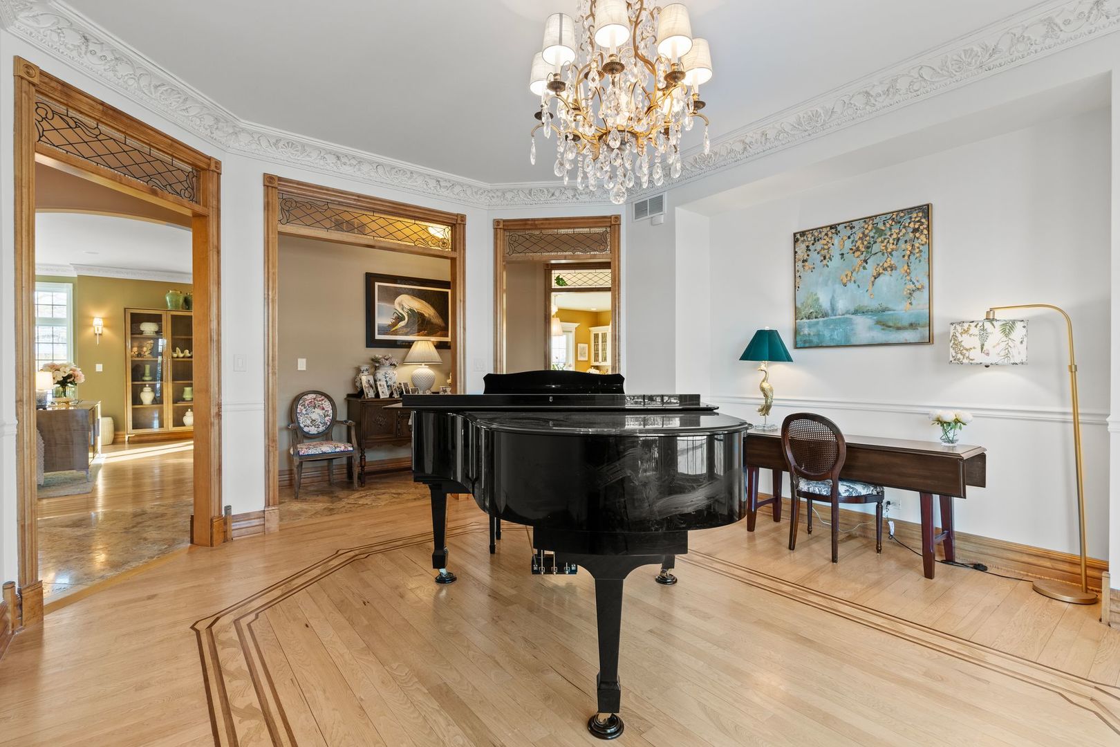 109 Singletree Road Orland Park, IL 60467 - Photo 14 of 66 a living room with furniture and a chandelier