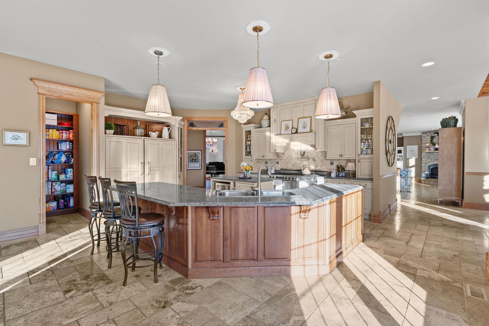 109 Singletree Road Orland Park, IL 60467 - Photo 25 of 66 a kitchen with stainless steel appliances kitchen island granite countertop a table chairs and a sink