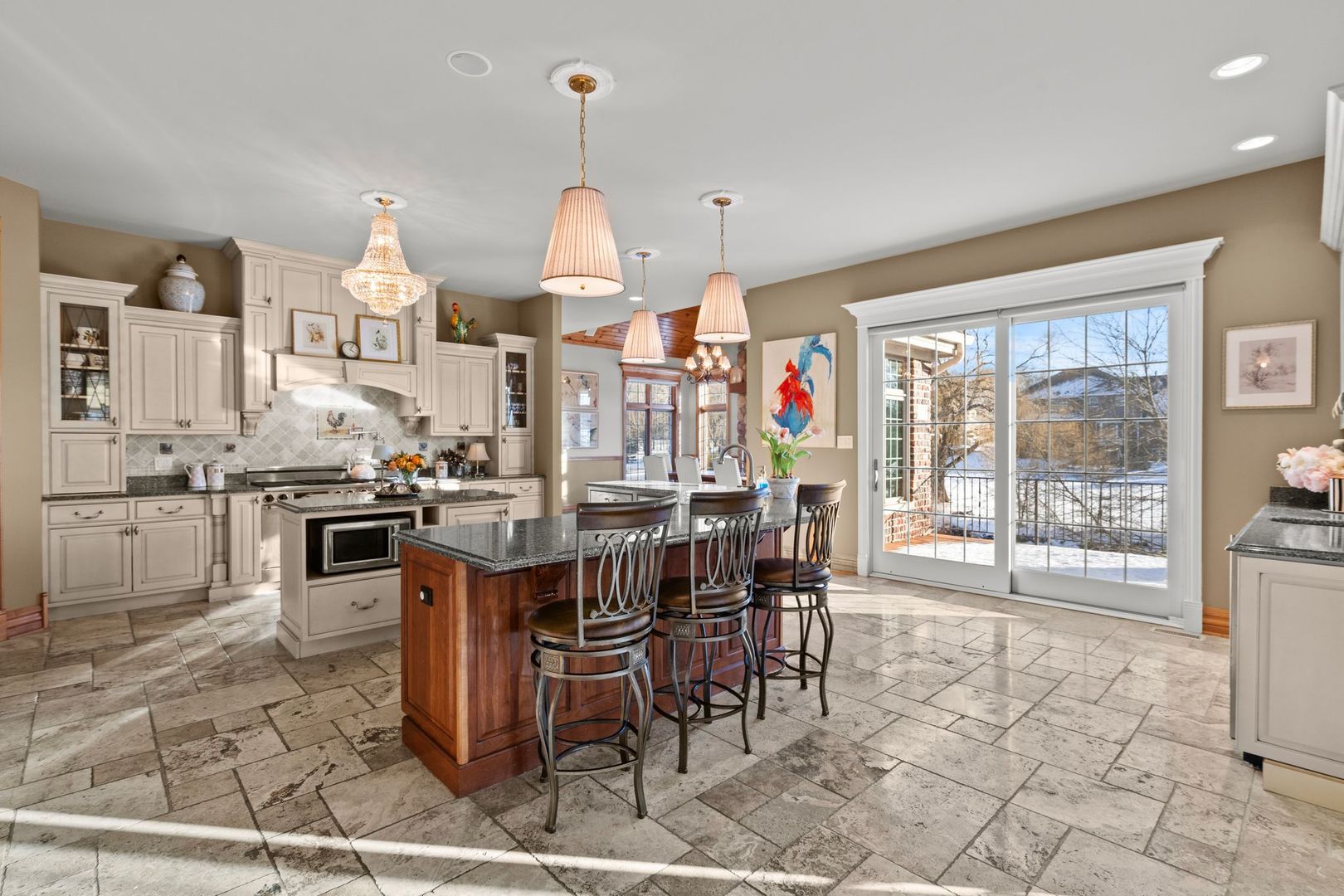 109 Singletree Road Orland Park, IL 60467 - Photo 26 of 66 a kitchen with stainless steel appliances a stove a sink a counter top space and a view of dining room