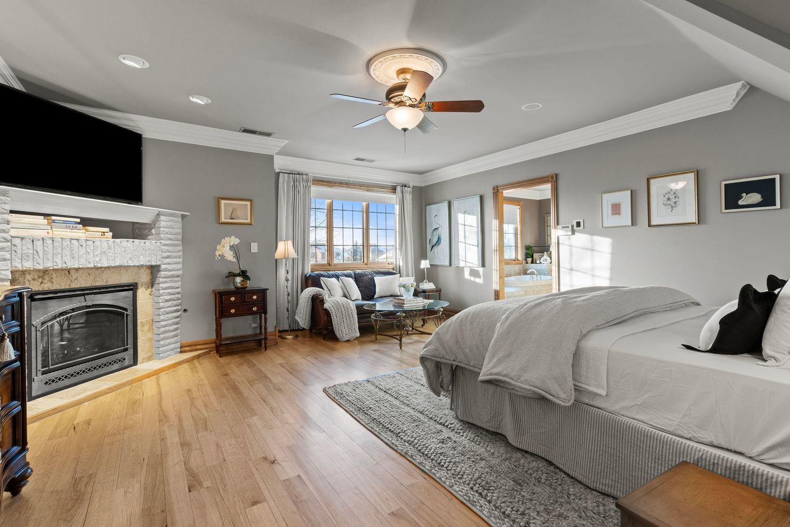 109 Singletree Road Orland Park, IL 60467 - Photo 36 of 66 a spacious bedroom with a bed and a chandelier