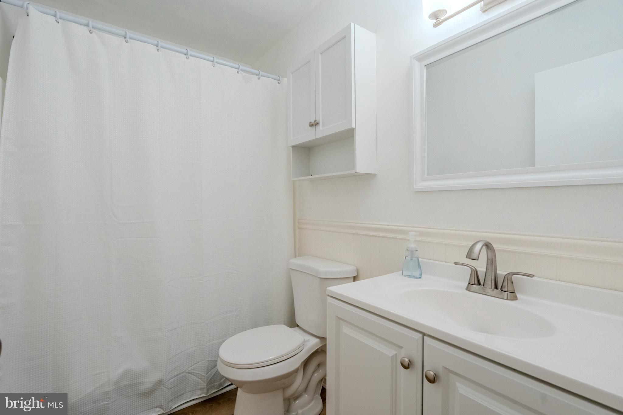 1016 West Baltimore Pike, Unit C11 Media, PA 19063 - Photo 11 of 18 a bathroom with a sink toilet and a mirror