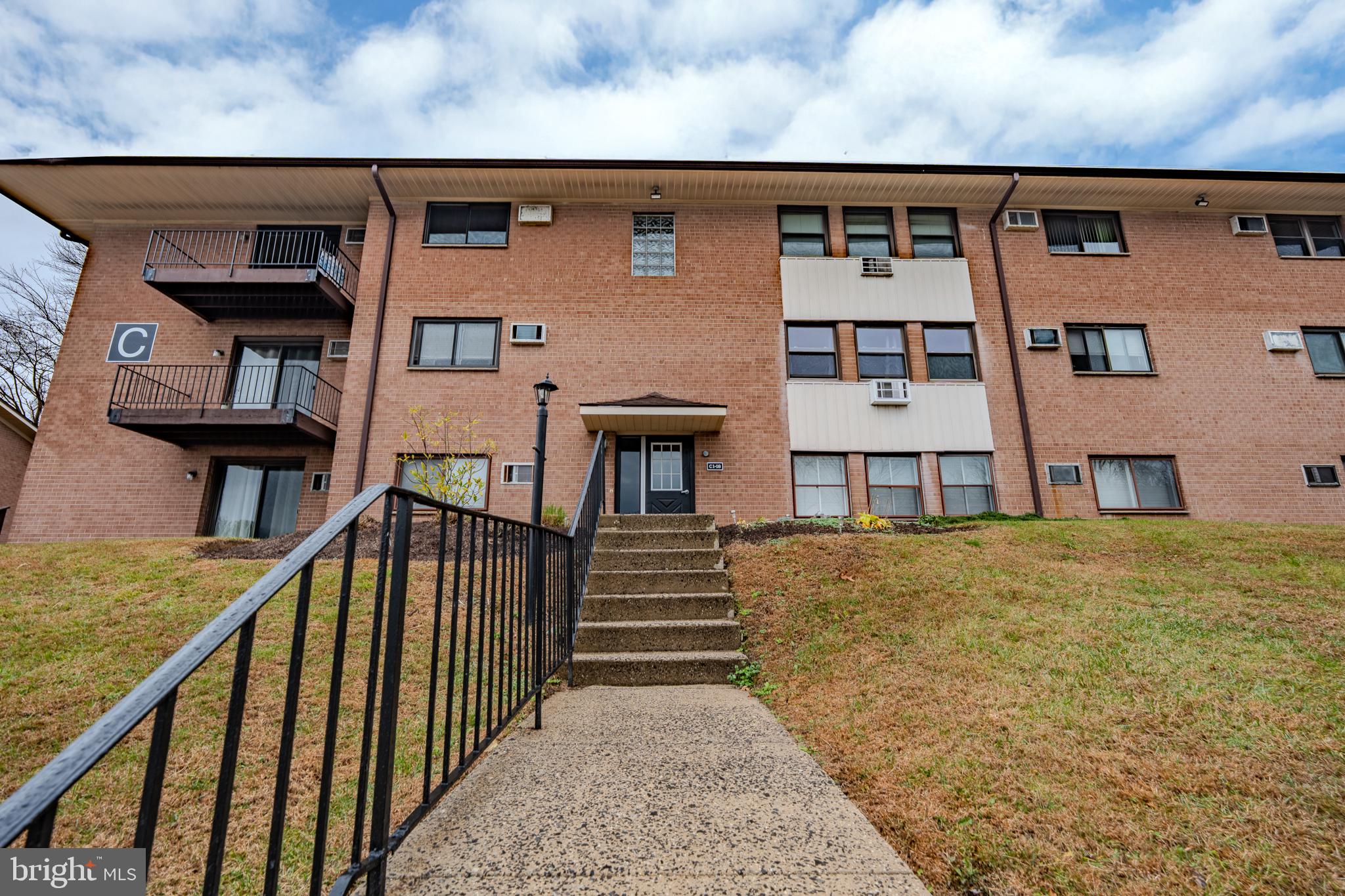 1016 West Baltimore Pike, Unit C11 Media, PA 19063 - Photo 2 of 18 a front view of a house with a yard