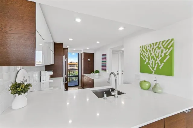 a living room with furniture and white walls