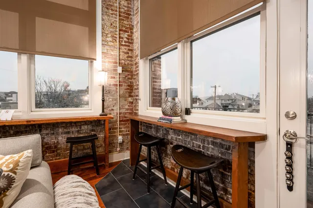 a room with furniture and a large window