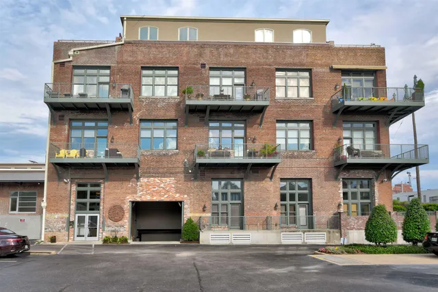 a front view of a building with a lot of windows
