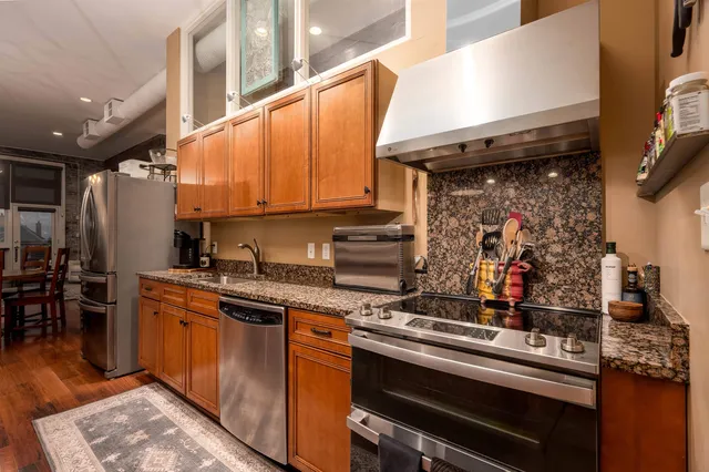 a kitchen with a stove and a microwave