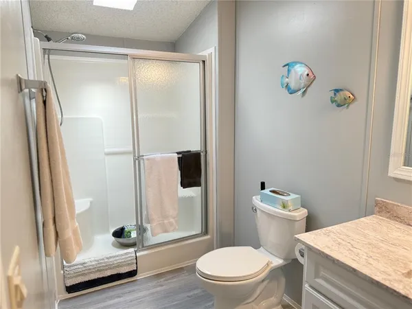a white toilet sitting next to a bathroom sink