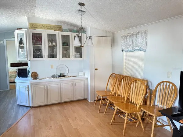 a view of a kitchen and dining room