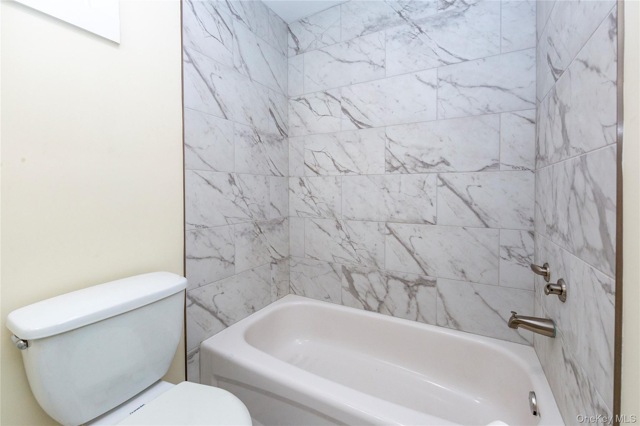 33 Holmes Road, Unit B Holmes, NY 12531 - Photo 15 of 16 a bathroom with a toilet and a bathtub