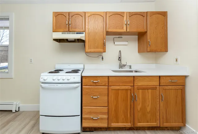 a view of dresser with washer and dryer