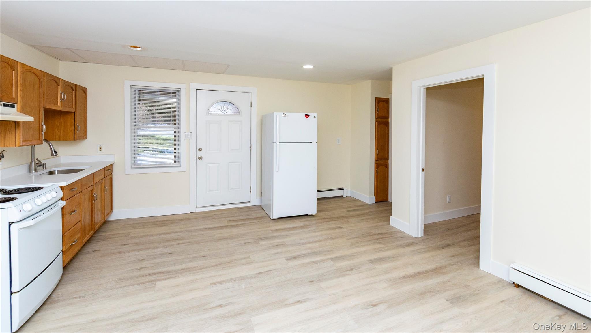 33 Holmes Road, Unit B Holmes, NY 12531 - Photo 9 of 16 a view of a kitchen with a sink and a refrigerator