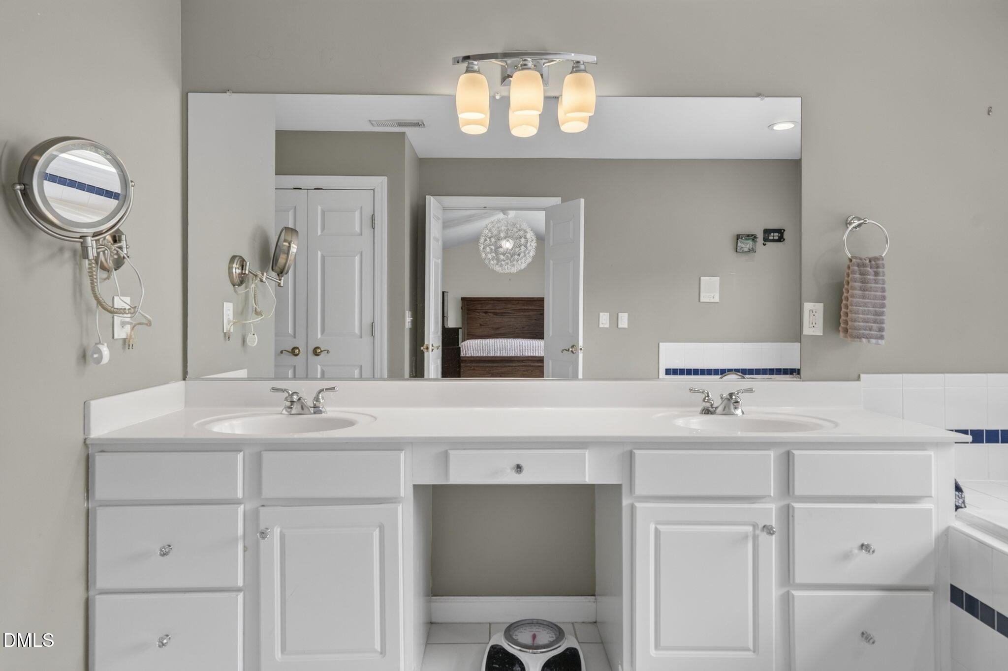 1258 Horsham Way Apex, NC 27502 - Photo 23 of 32 a bathroom with a sink and a mirror