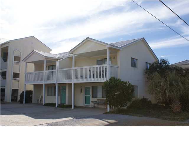 6015 Highway Santa Rosa Beach, Unit 2B 30A Santa Rosa Beach, FL 32459 - Photo 1 of 11 a front view of a house with a garden