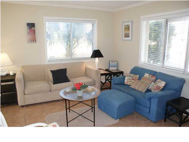 6015 Highway Santa Rosa Beach, Unit 2B 30A Santa Rosa Beach, FL 32459 - Photo 2 of 11 a living room with furniture and a large window