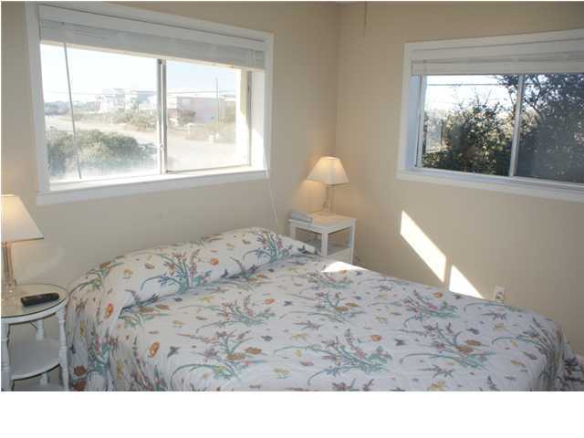 6015 Highway Santa Rosa Beach, Unit 2B 30A Santa Rosa Beach, FL 32459 - Photo 6 of 11 a bedroom with a bed and a window