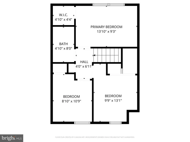 a picture of a building with a white fence